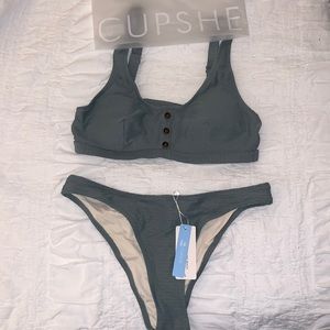 Army green step piece bathing suit with cut out back.